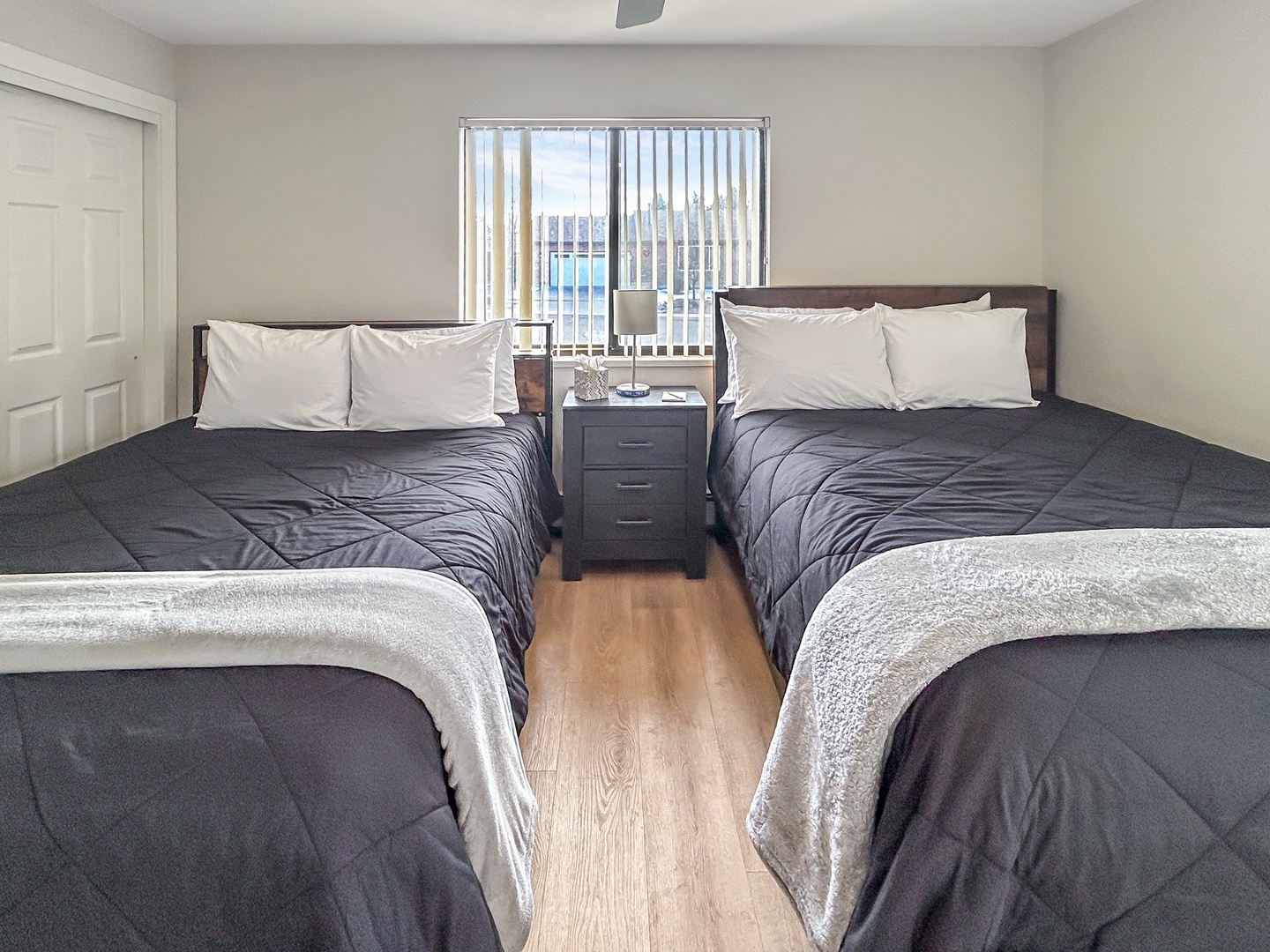 Two comfortable queen beds await with soft linens and warm throws.