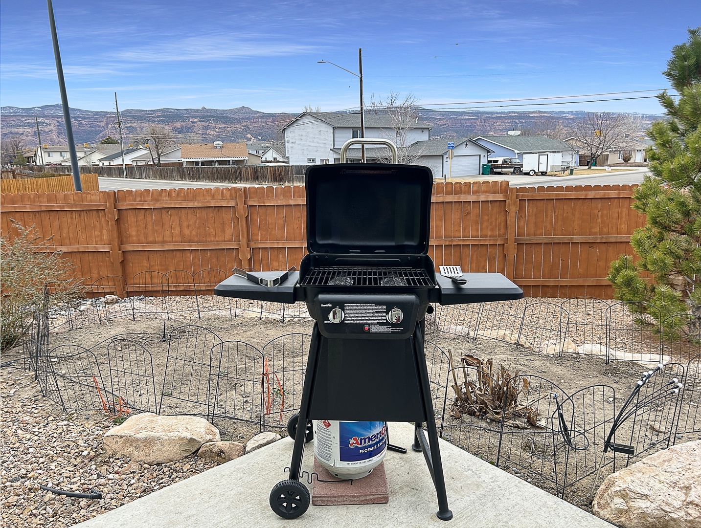 Fire up your outdoor cooking adventures with this well-equipped gas grill, perfectly positioned for memorable backyard barbecues.