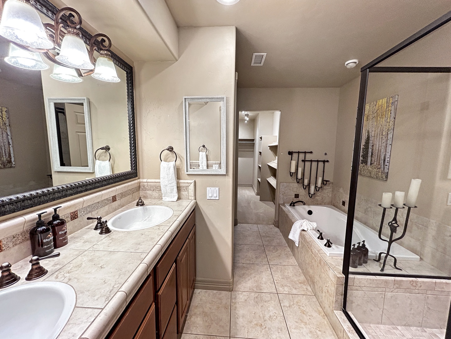Luxurious spa-style master bedroom private en-suite bathroom with soaker tub, walk-in shower and spacious walk-in closet.