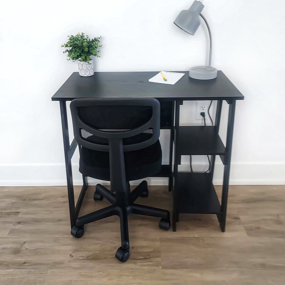 Small desk near dining area.