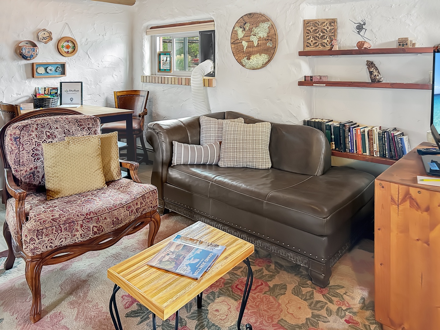 Curl up with a book in this charming library corner, where vintage charm meets modern comfort with eclectic furnishings and stories.