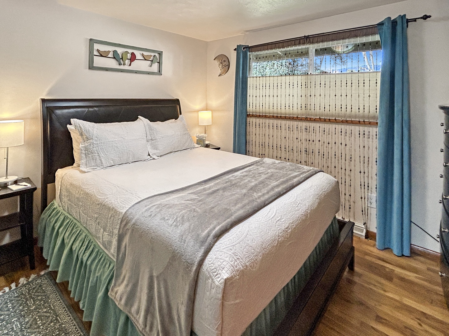 Cozy bedroom with crisp linens and gentle natural light.