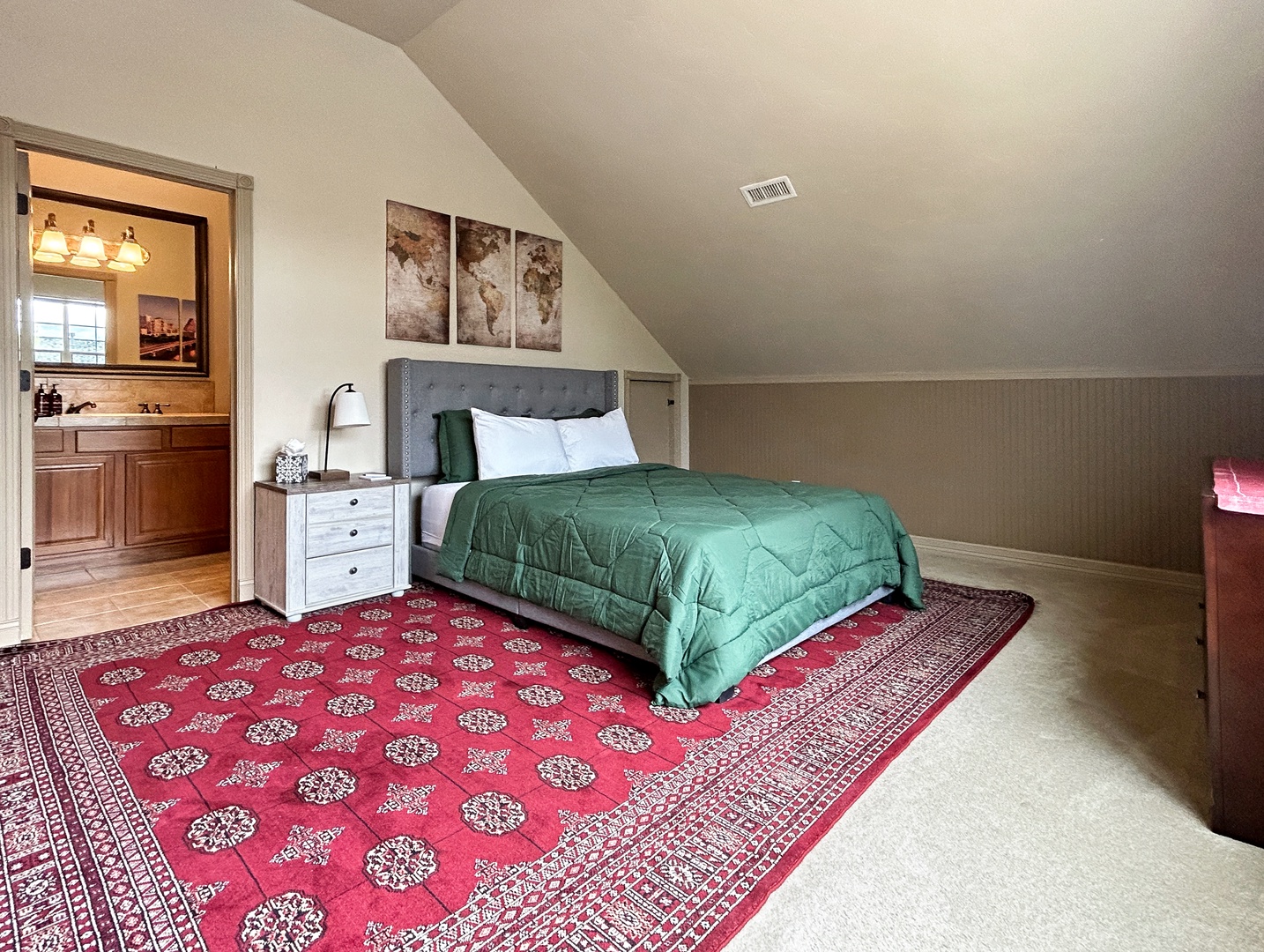 Cozy third floor bedroom with comfy queen bed and private en suite full bathroom and walk-in closet.