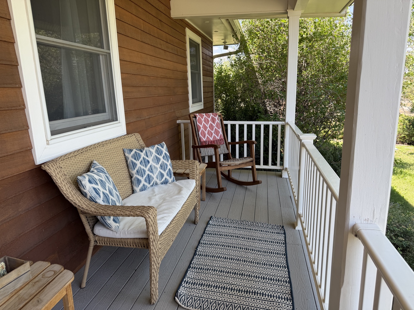 Settle into your own covered porch retreat, perfect for your morning coffee or a quiet evening unwind.