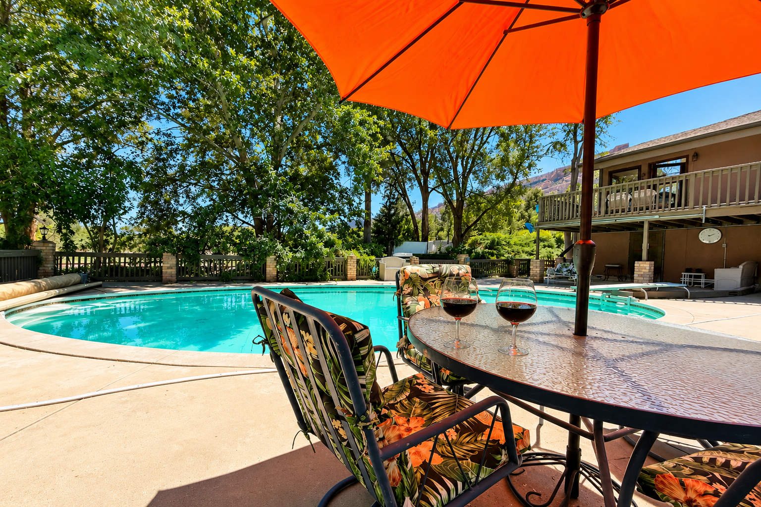Sip wine poolside under the shade of your private umbrella, surrounded by towering trees and your own sparkling oasis.