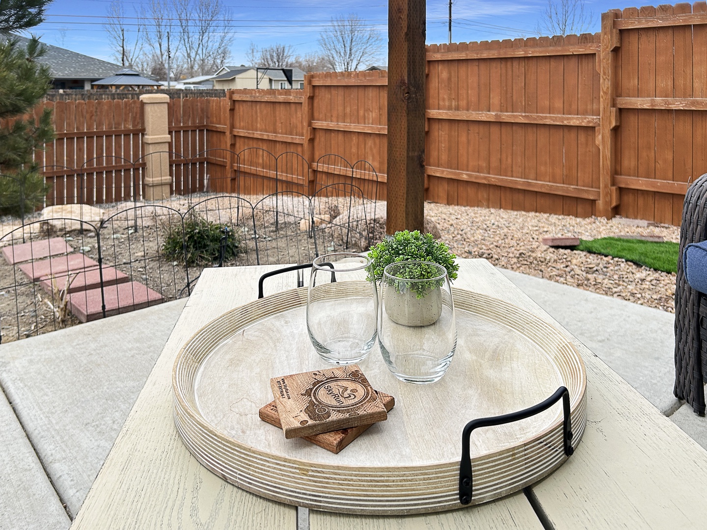 Private backyard patio with grill