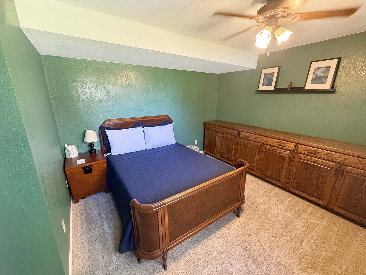 Unwind in your peaceful bedroom, where soft mint walls and a cozy bed invite restful nights.