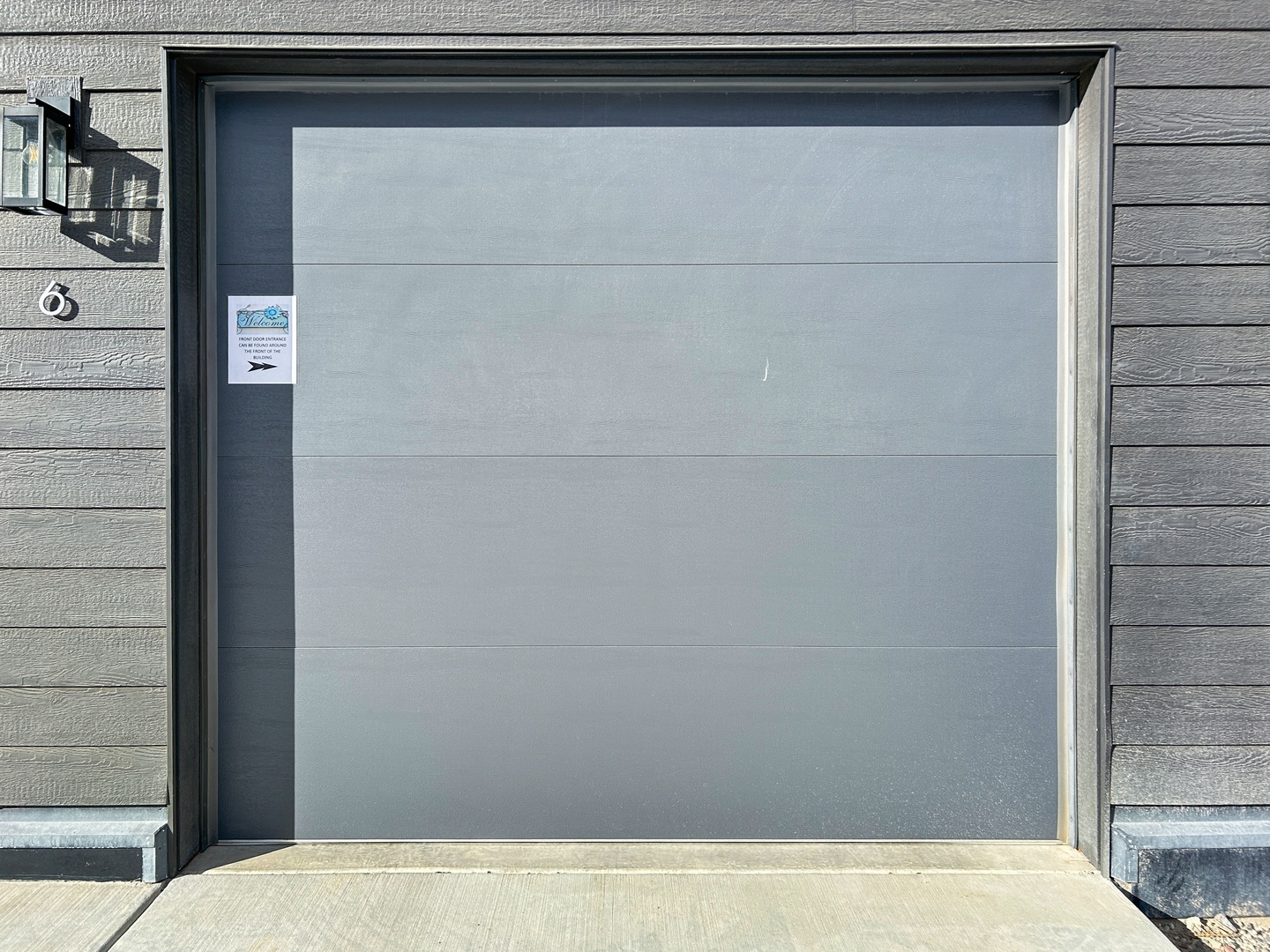Secure parking available with this modern garage door, ensuring your vehicle stays protected during your stay.