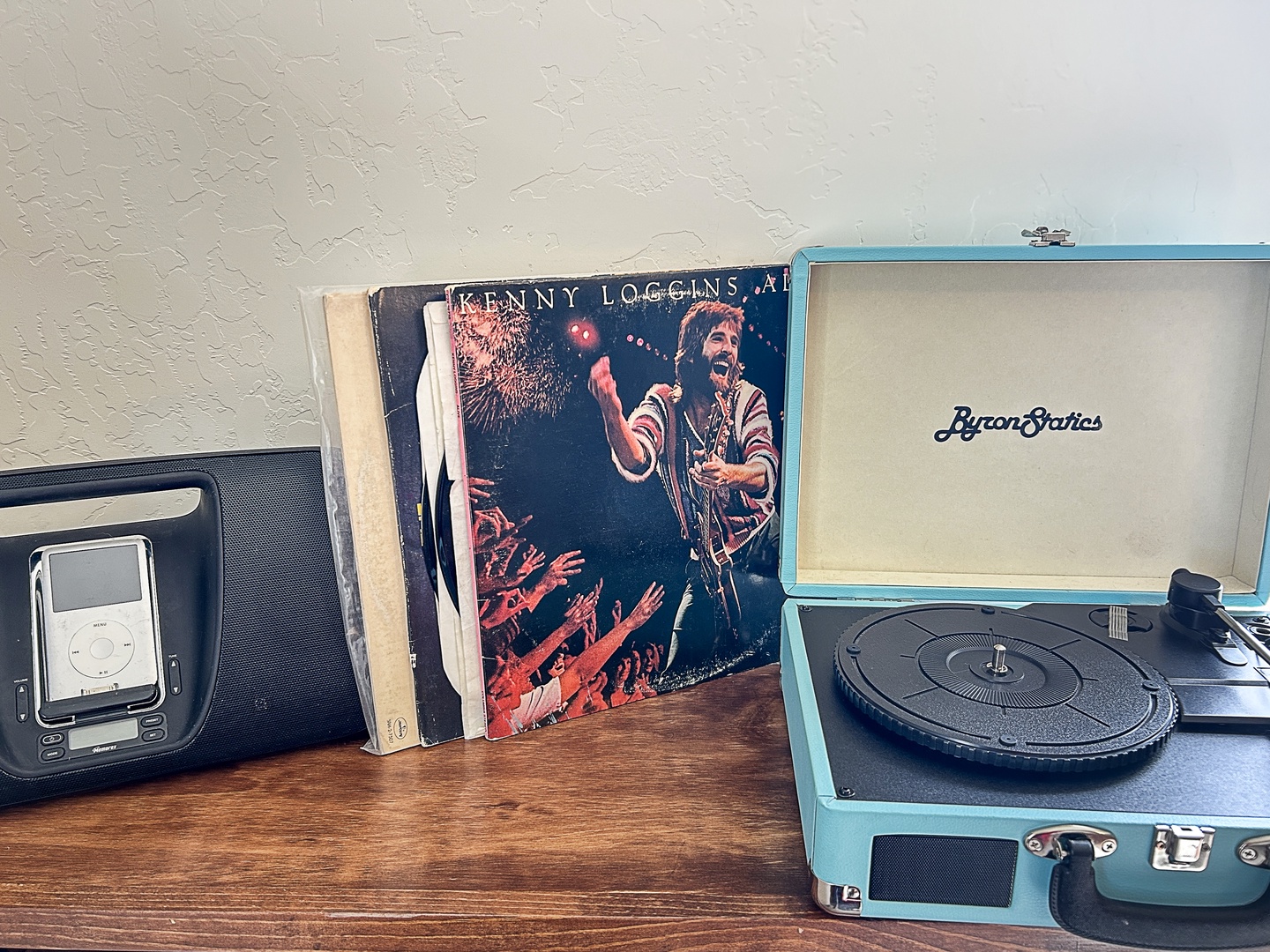 Spin your favorite vinyl on this vintage turntable while your phone charges nearby - perfect for cozy evenings in.