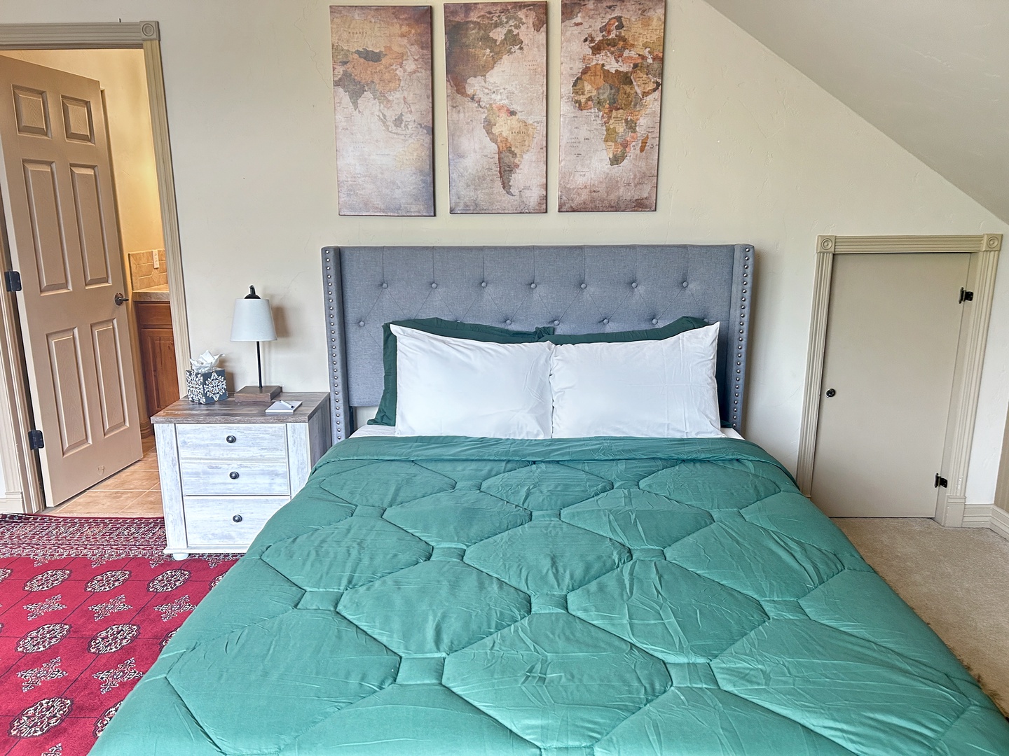 Rest peacefully in your comfortable bedroom featuring a plush tufted headboard, crisp linens, and worldly touches that inspire dreams of adventure.