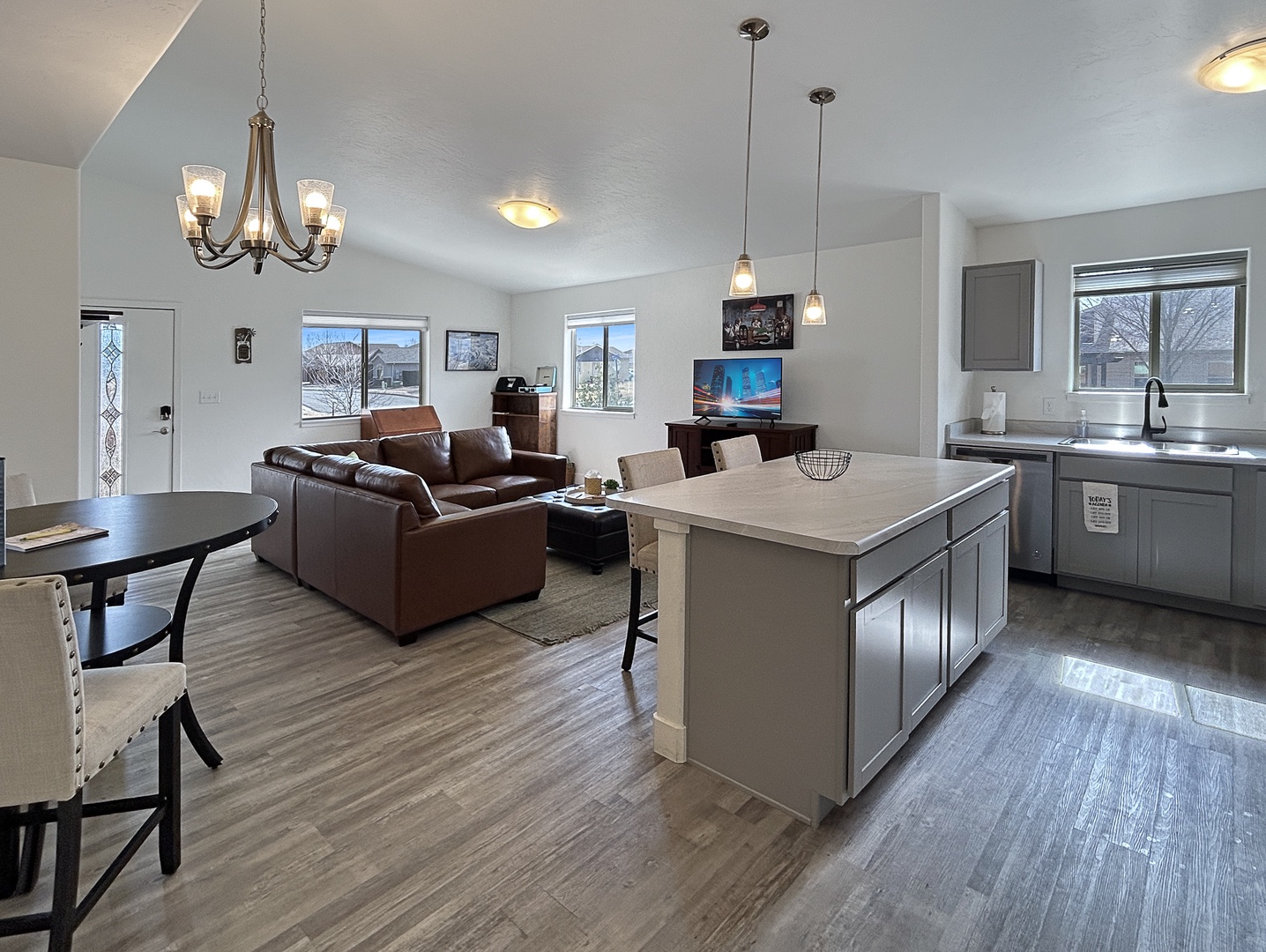 Settle into your bright open-concept space where your fully equipped kitchen island flows seamlessly into the cozy living room.