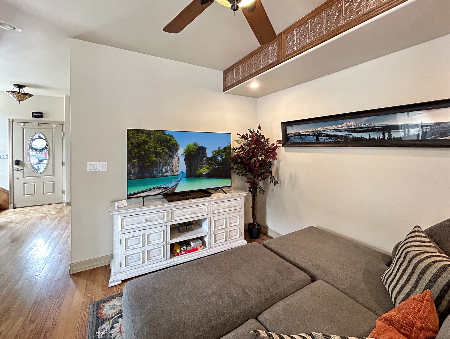 Unwind in your spacious living area with plush seating and large TV for cozy movie nights together.