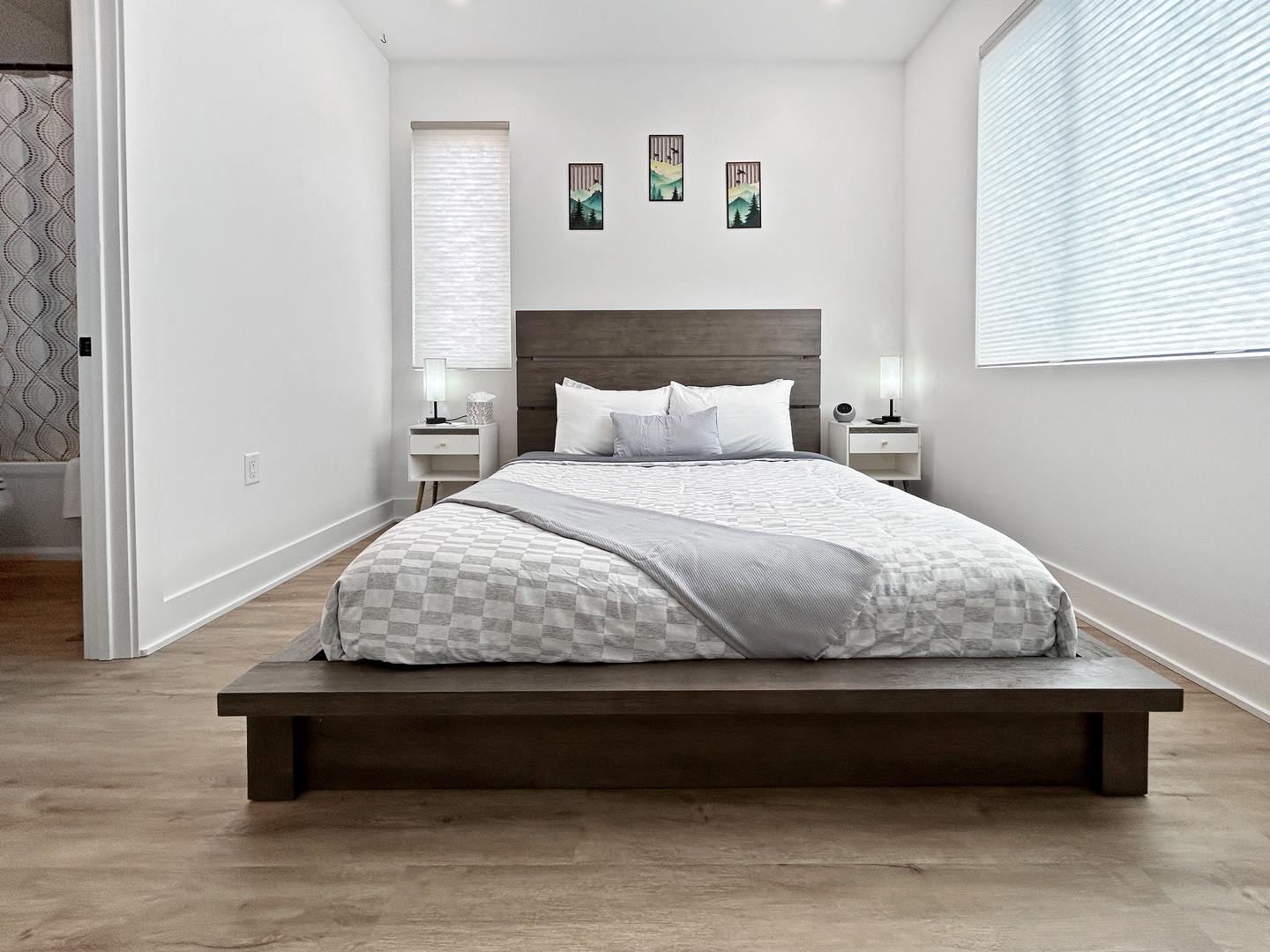 Drift off in your serene bedroom sanctuary with crisp linens and modern touches creating the perfect restful retreat.