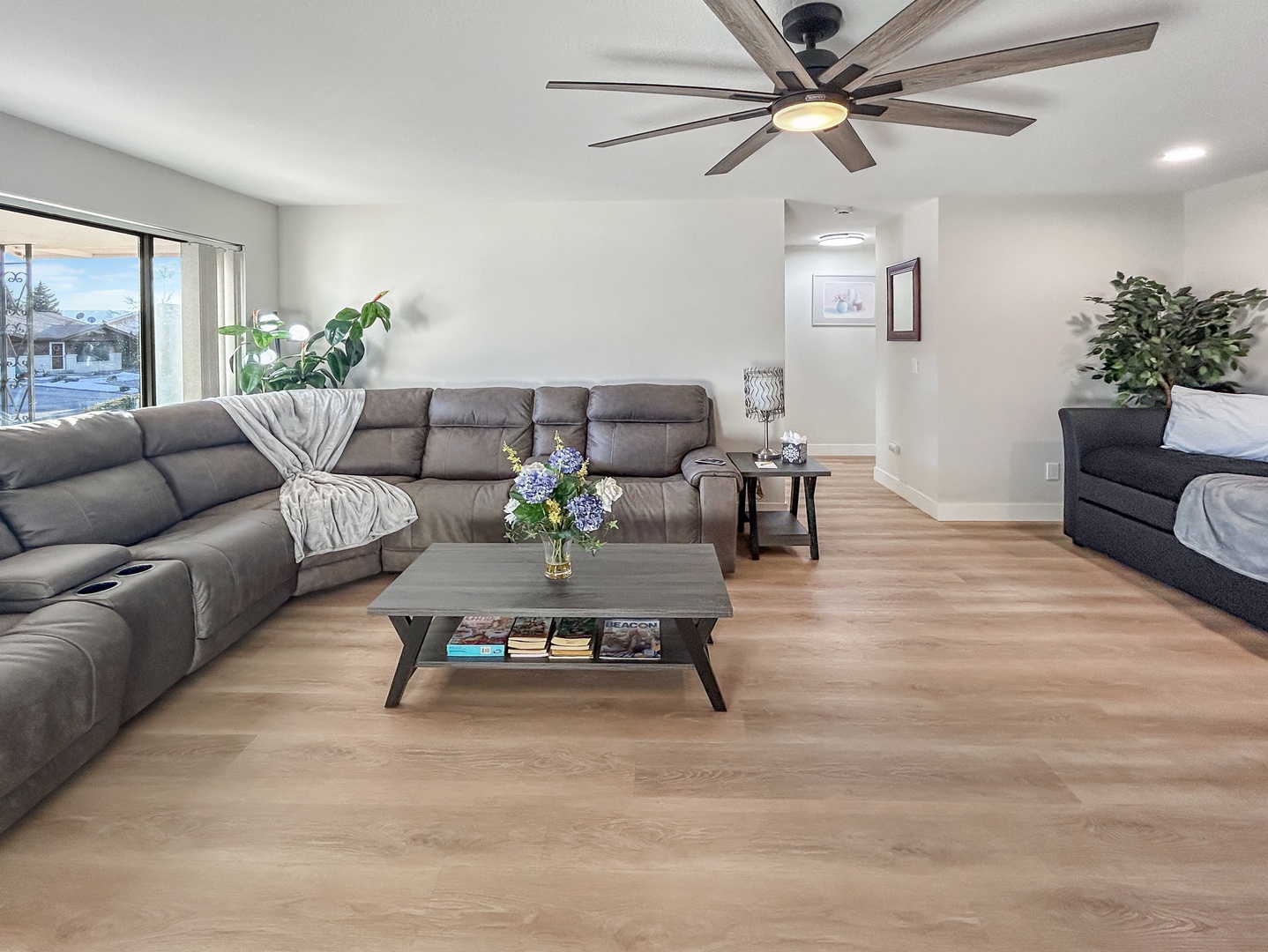 Sink into plush sectional seating in your bright, modern living and natural light create a welcoming atmosphere.