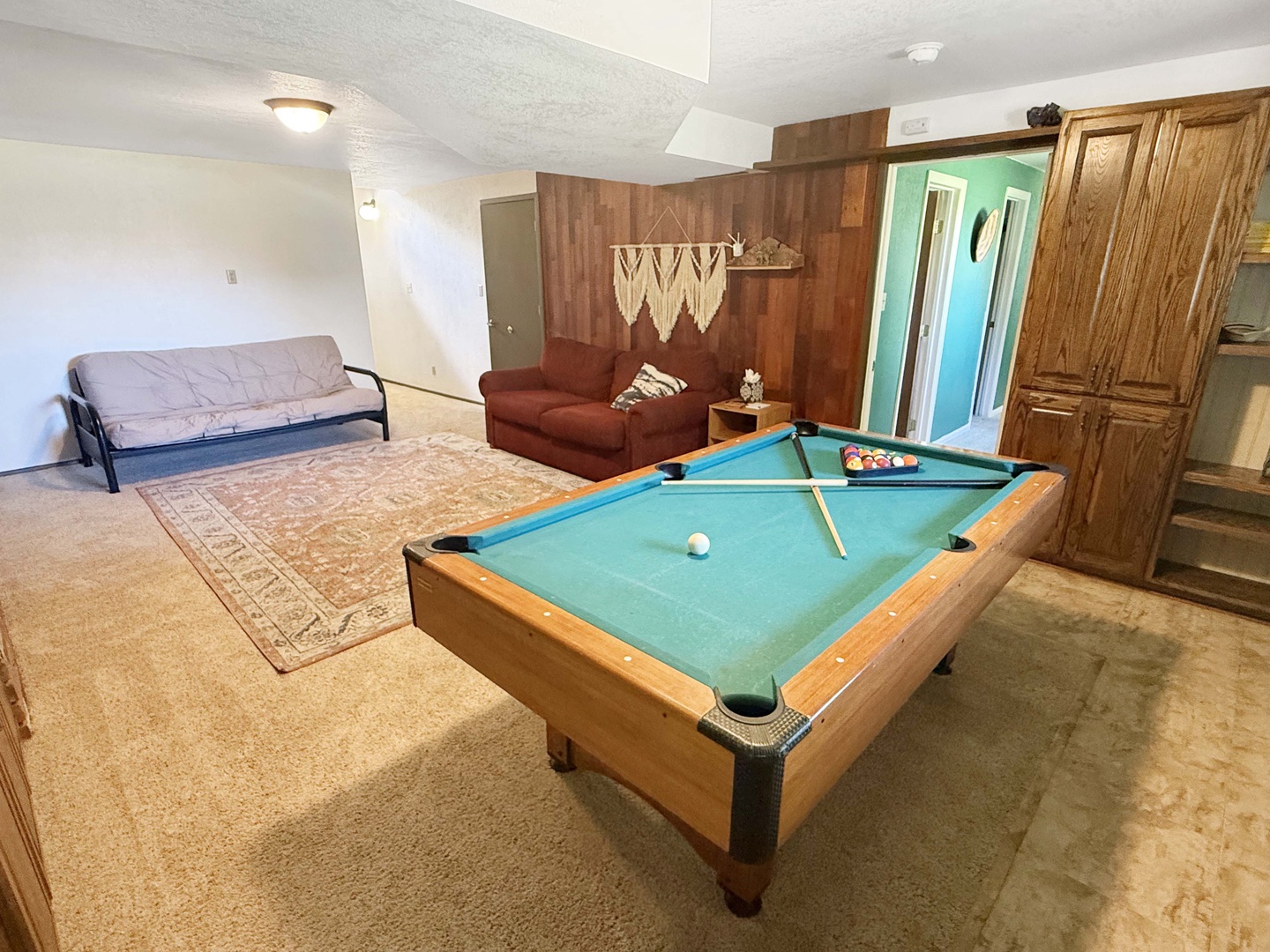 Challenge your travel companions to a game of pool in this cozy rec room, complete with extra sleeping space and a comfortable lounge area.