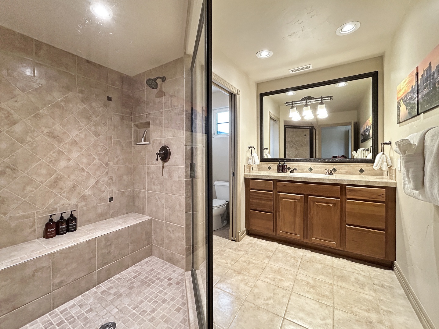 Second floor bedroom private en suite bathroom with walk-in shower featuring dual showerheads for a more spacious and comfortable experience.