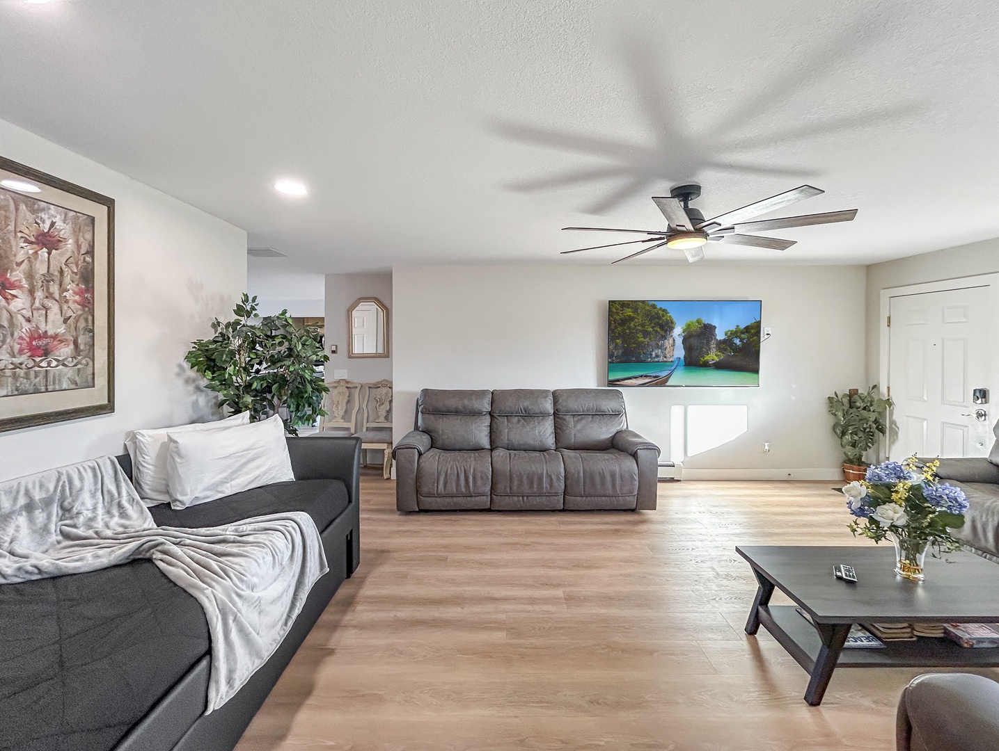 Unwind in your spacious living room with plush seating, trundle day bed and smart tv