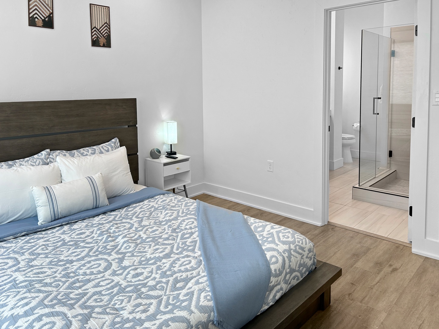 Master bedroom with private en suite full bathroom and comfy queen bed.