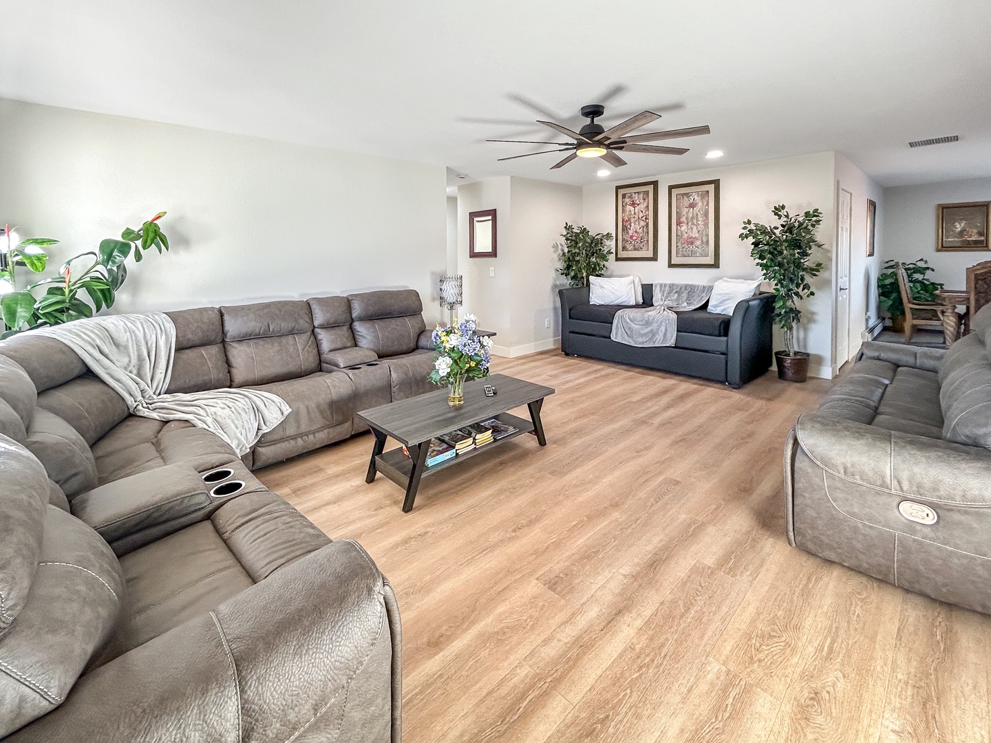 Sink into plush seating and unwind in your spacious living room, complete with a ceiling fan and smart tv.
