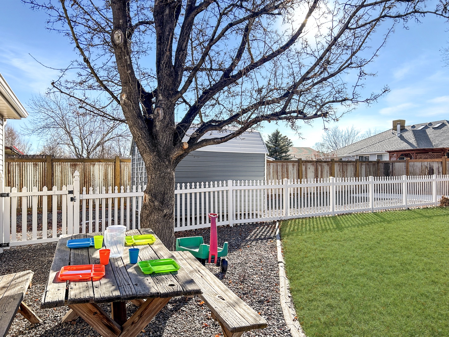 Your private backyard features a picnic table perfect for outdoor meals.
