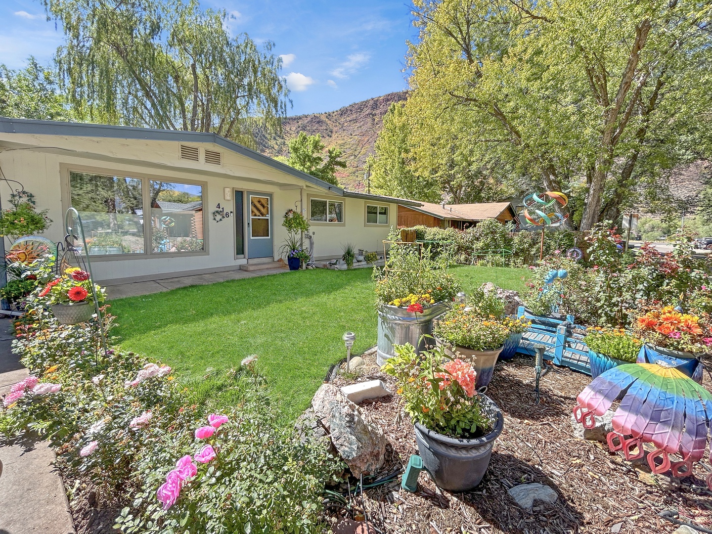 Enjoy a beautiful view of the thoughtfully landscaped front yard.