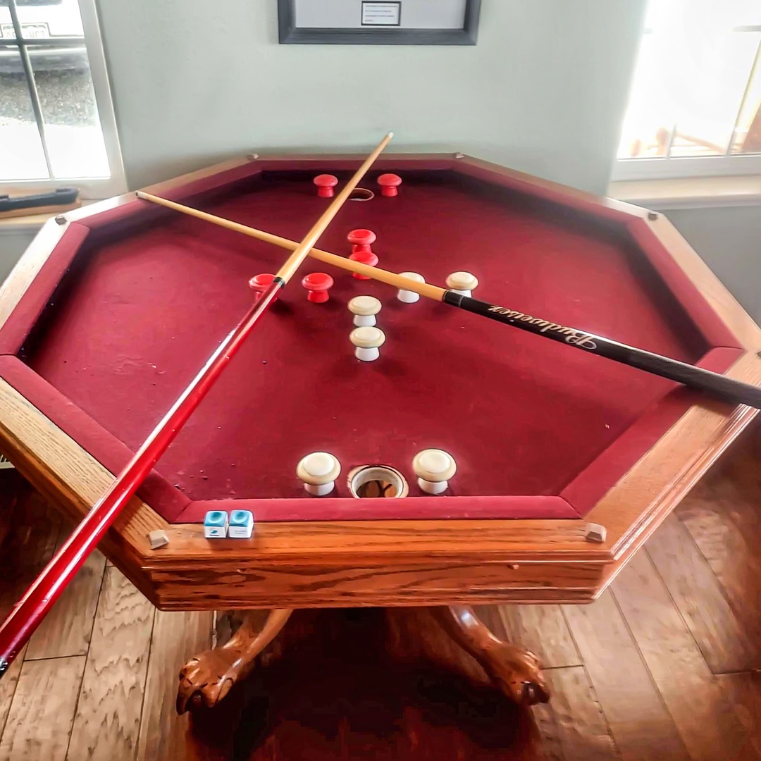 Challenge friends to a game on this unique hexagonal pool table, perfectly positioned by the windows for natural light during your stay.