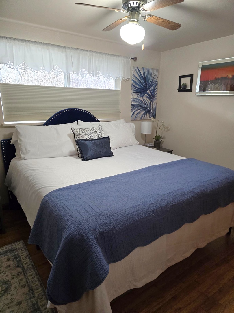 Comfy bed with beautiful artwork for restful nights