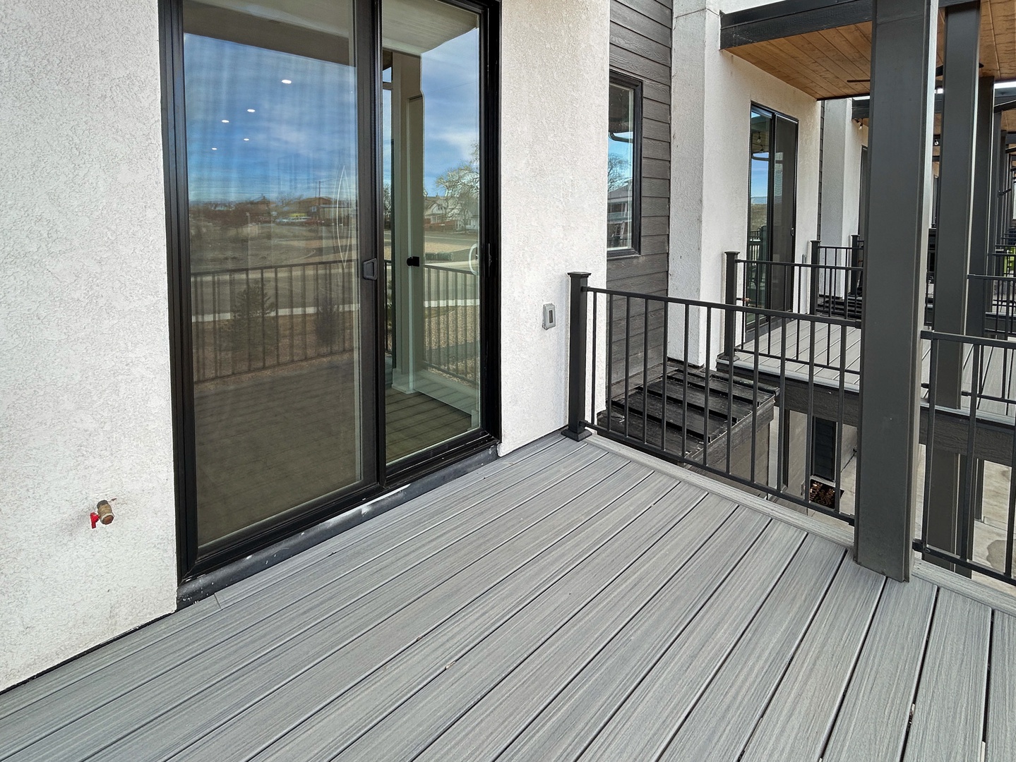 Step out onto your private balcony and breathe in fresh air while enjoying peaceful outdoor moments on this modern deck.