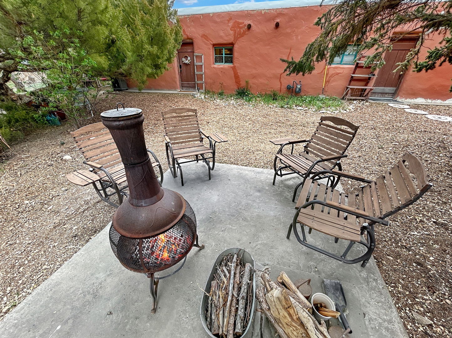 Gather around your private fire pit for cozy evenings under the stars, surrounded by comfortable seating in this peaceful desert courtyard.