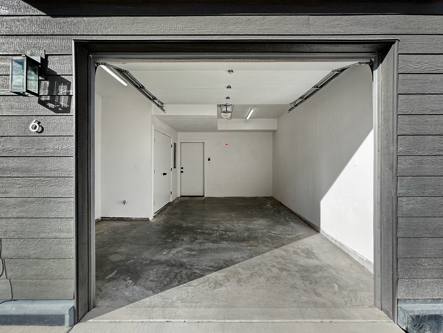 A spacious garage provides secure parking for your vehicles and storage needs during your stay.