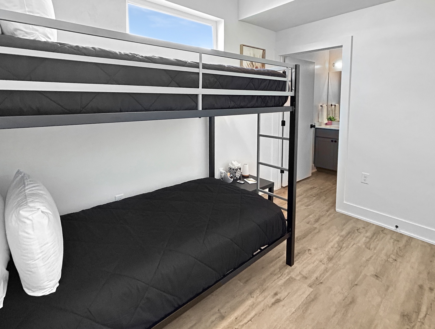 Your cozy bunk bed room offers comfortable sleeping for two with modern fixtures and natural light with its own private en suite full bathroom.
