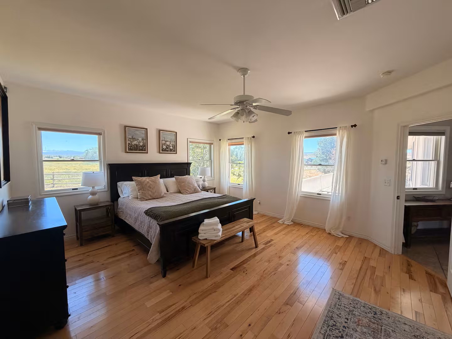 Wake up to sweeping views framed by bright windows in your spacious king bed.