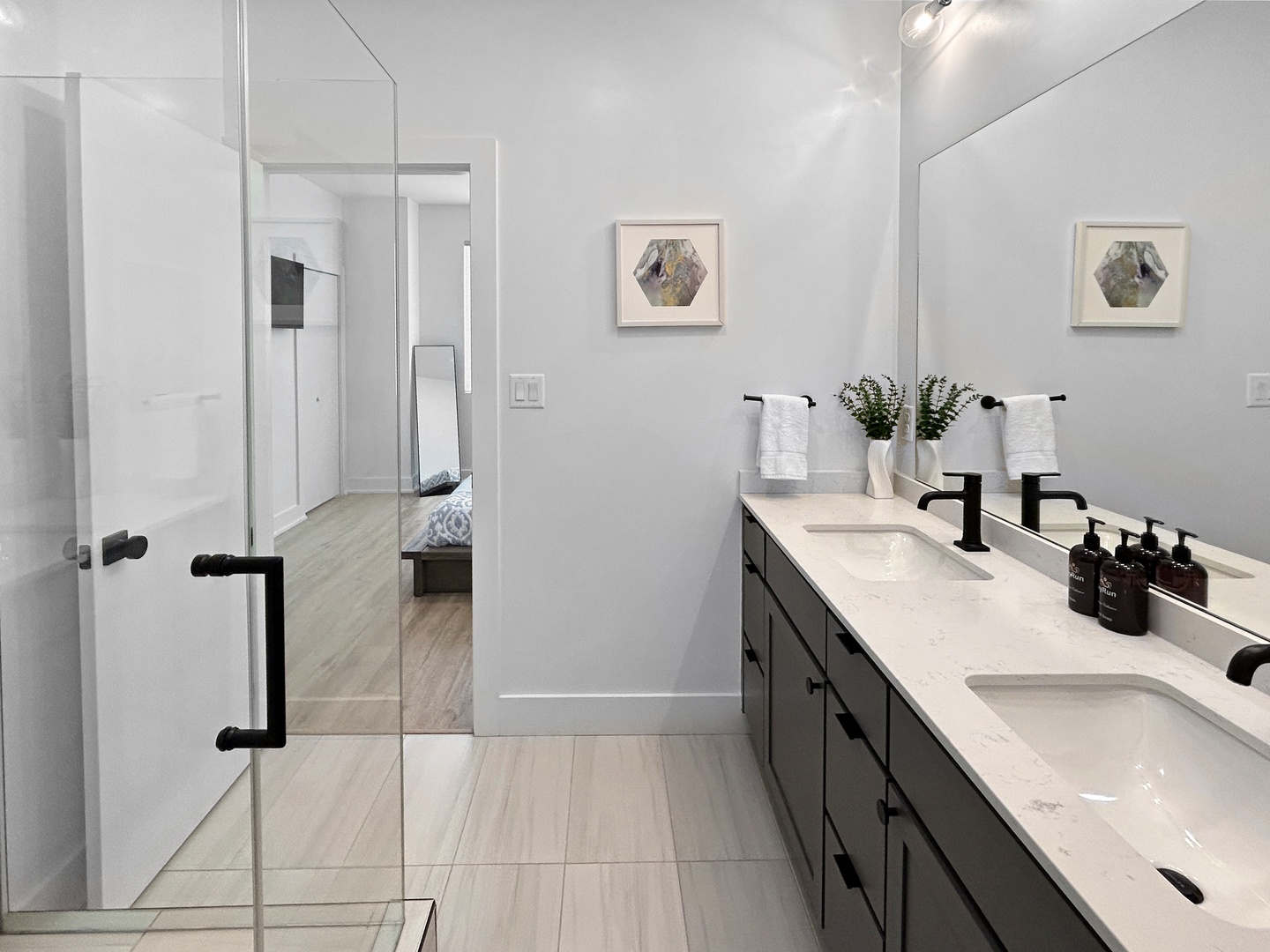 Your spa-like ensuite features dual vanities and a spacious glass shower.