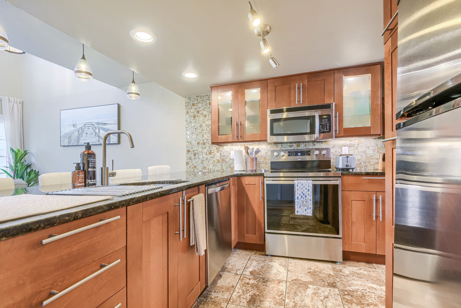 Fully equipped kitchen with granite counters and stainless steel appliances