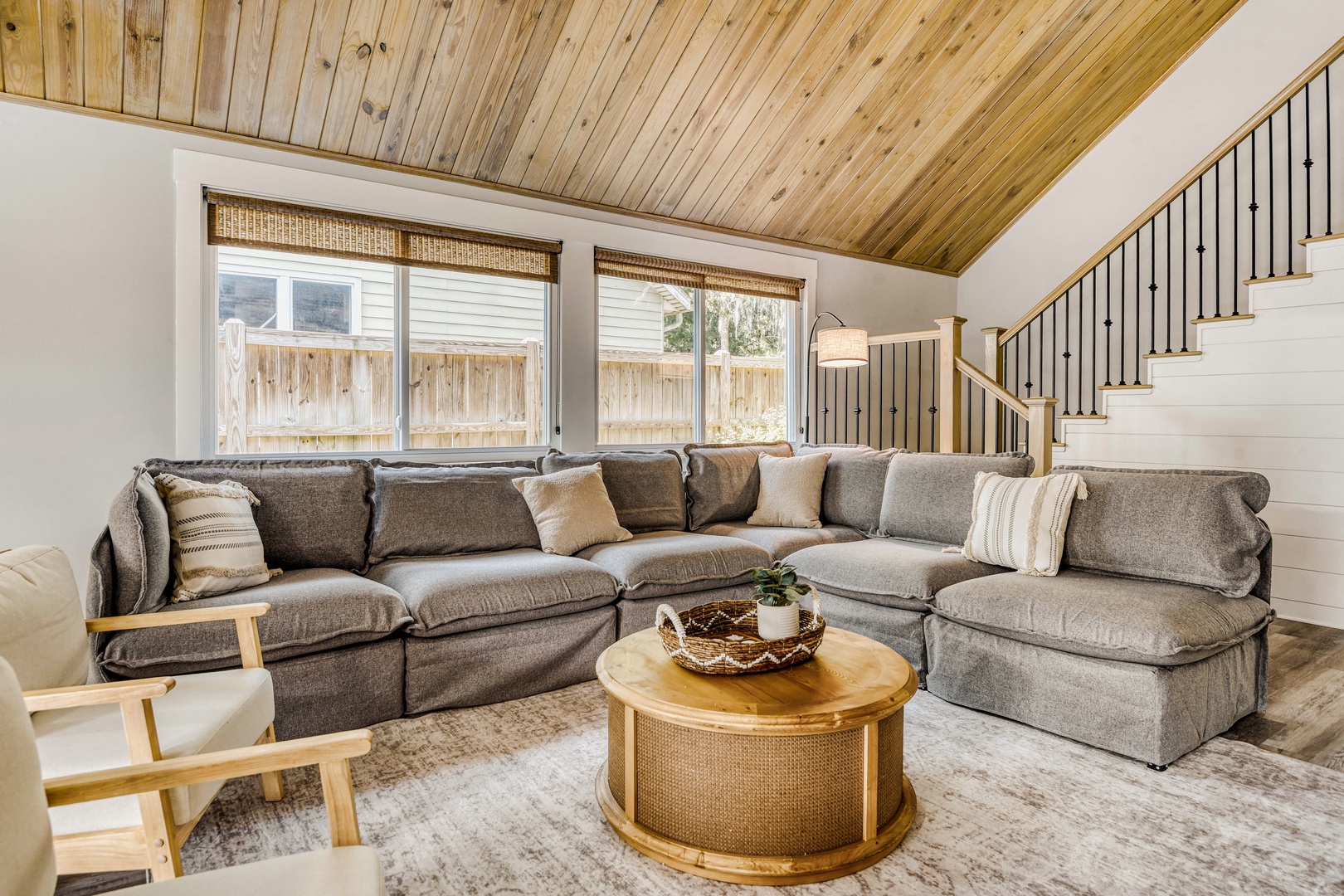 Sink into plush sectional seating beneath wood ceilings.