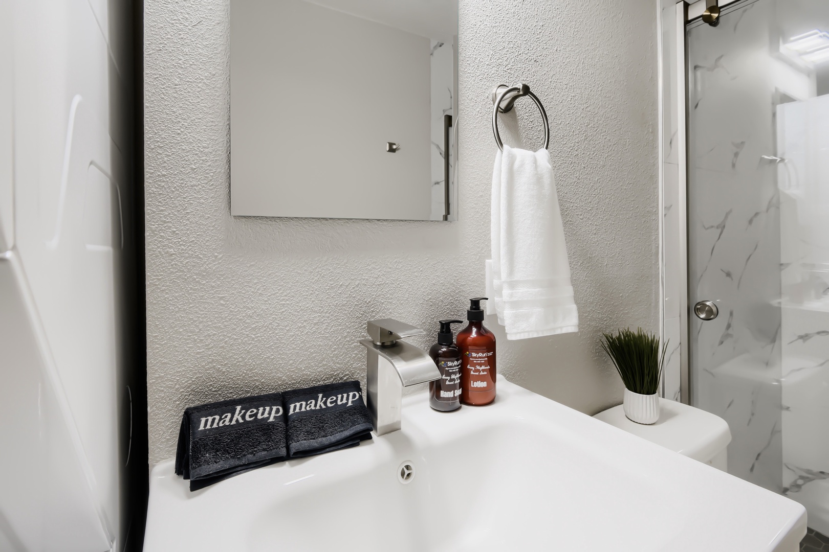 Bathroom vanity with hand soap and lotion provided