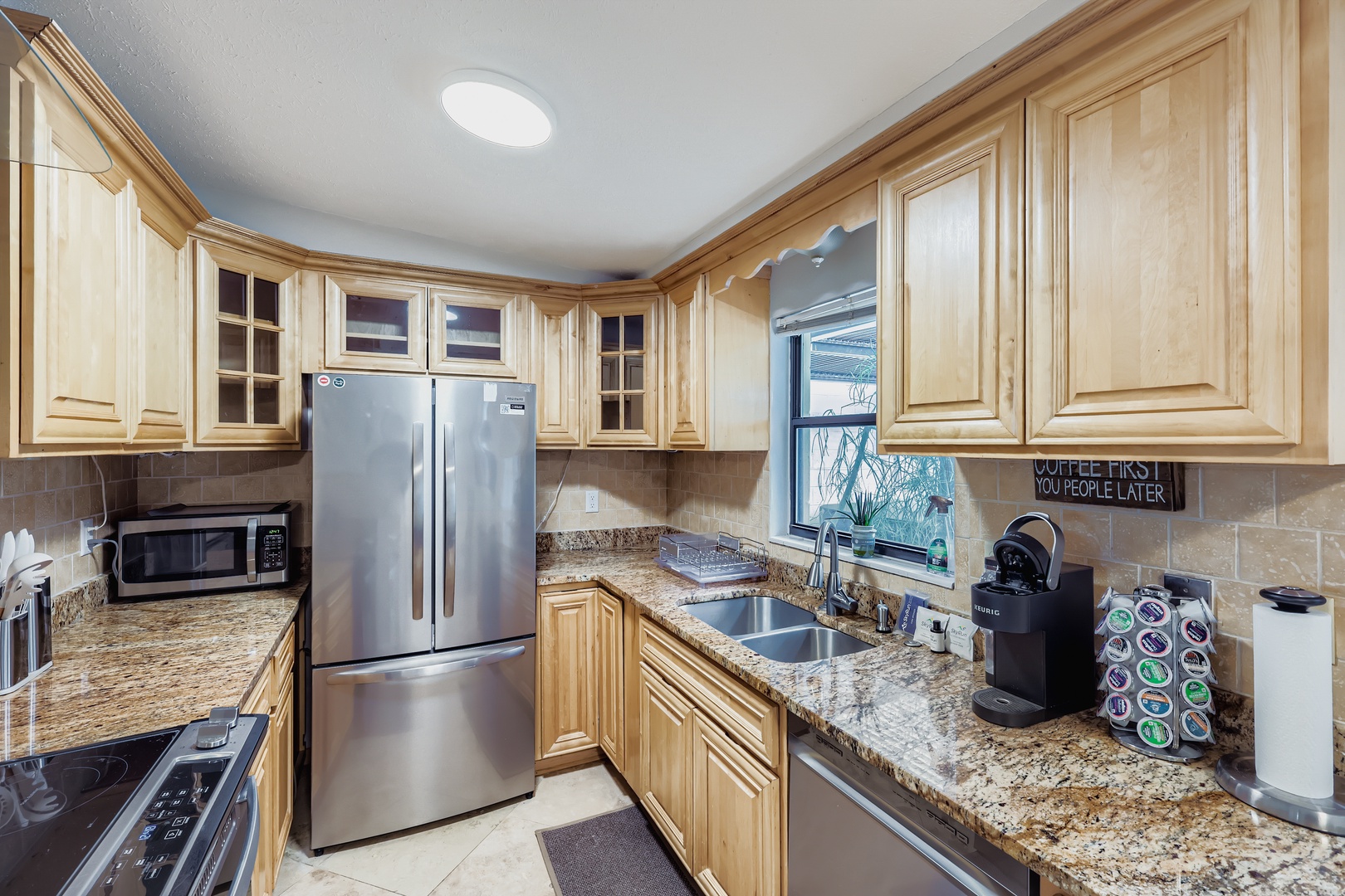 Fully loaded kitchen, sunny cooking haven.