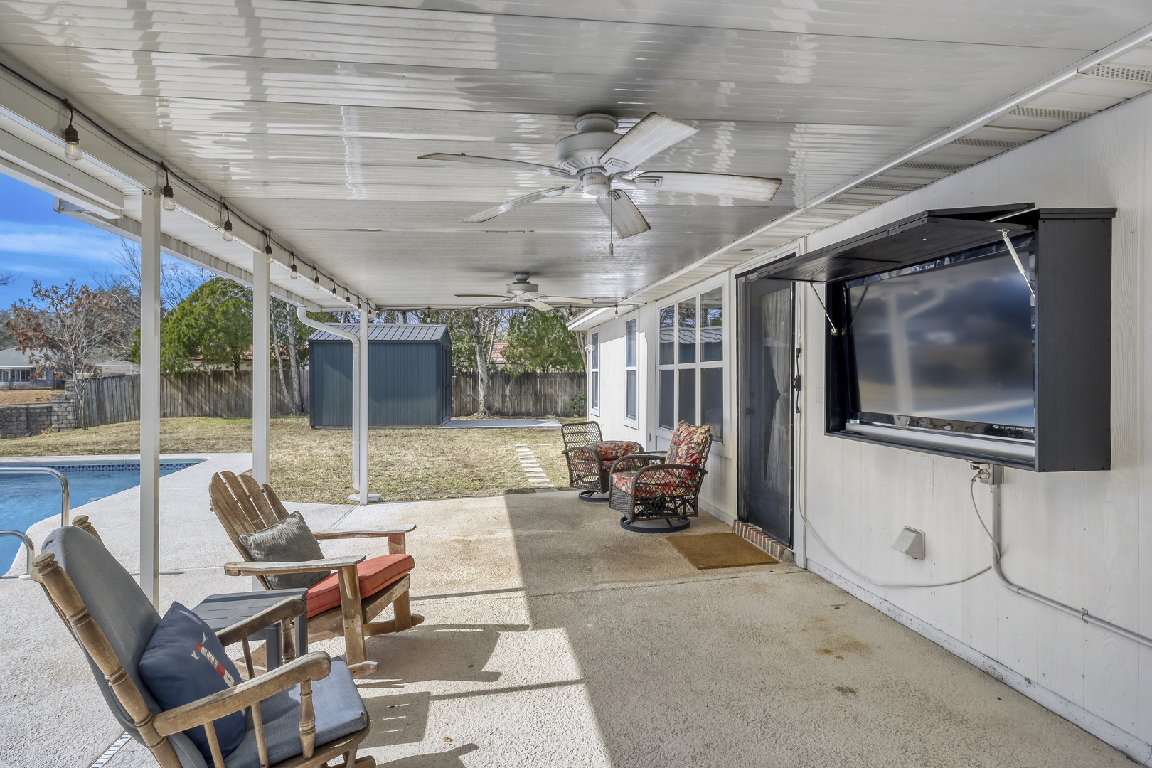 Spacious covered patio outdoor TV.