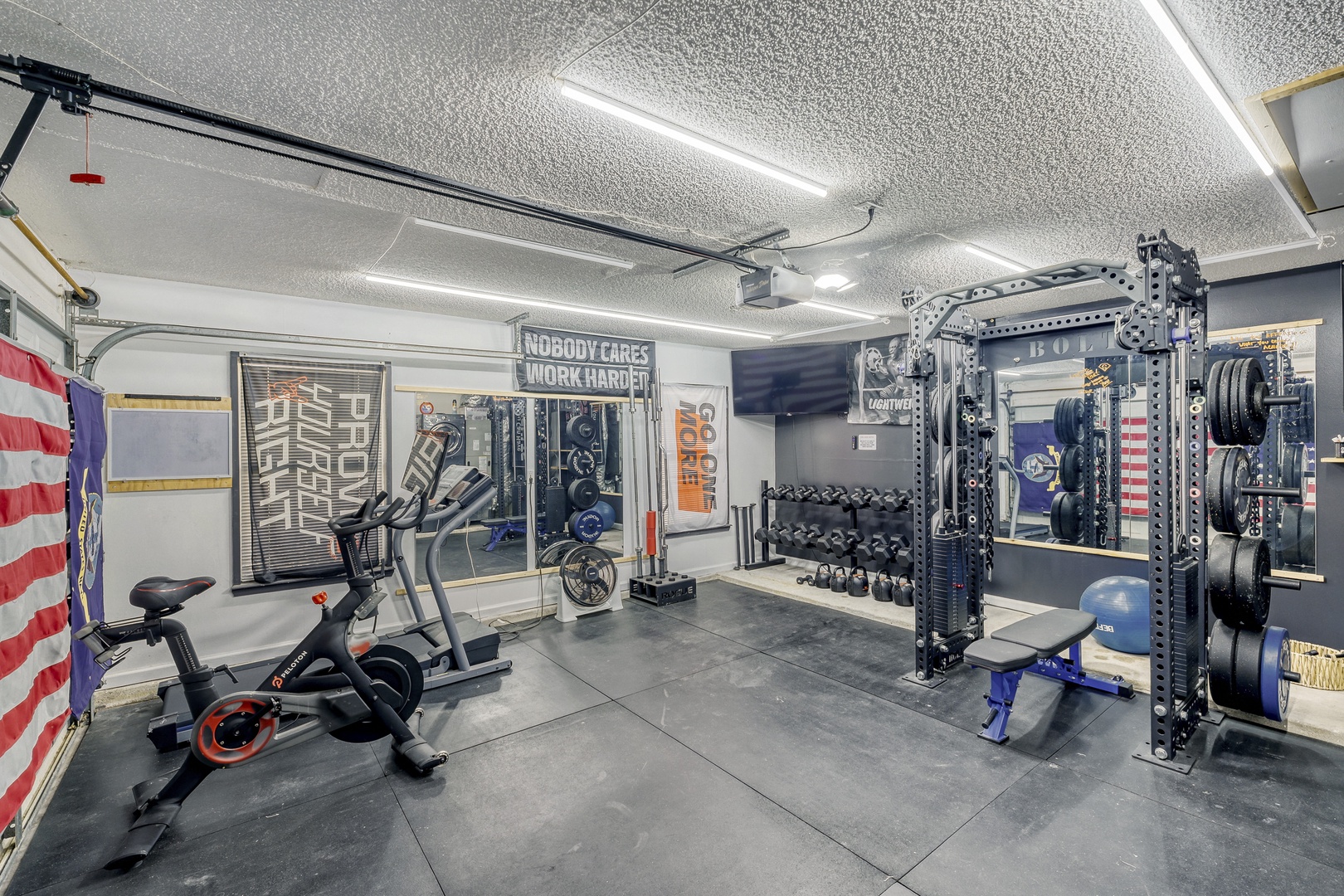 Spacious home gym with Peloton