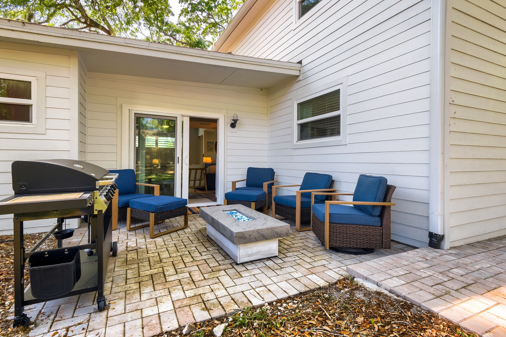 Inviting Backyard with BBQ Grill & Fire Pit