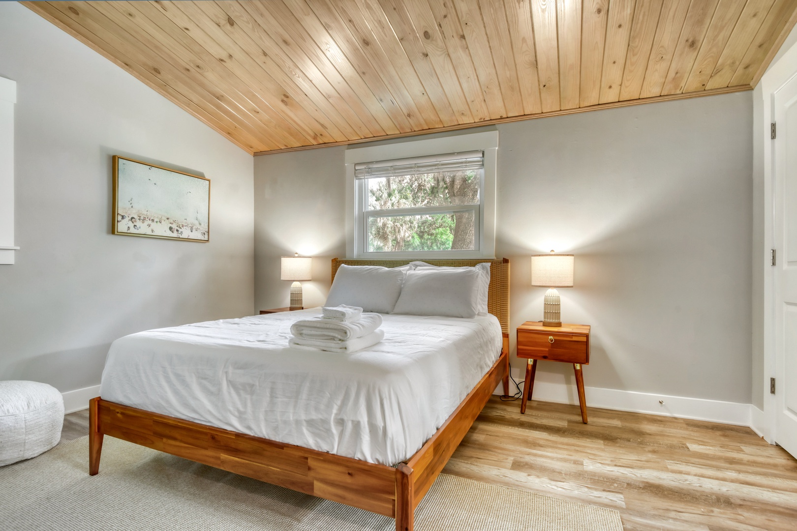 Serene Queen Bedroom with Reading Chair & Natural Light