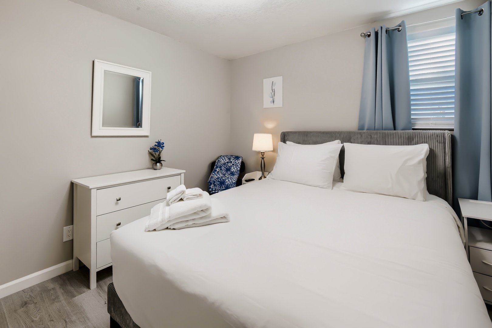 Restful primary queen bedroom with fresh towels for your stay