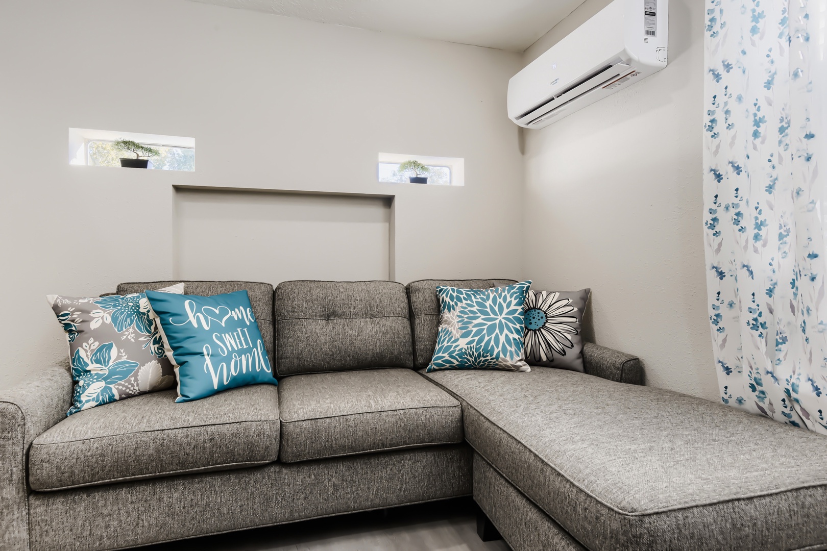 Queen sleeper sectional with ductless mini-split air conditioning