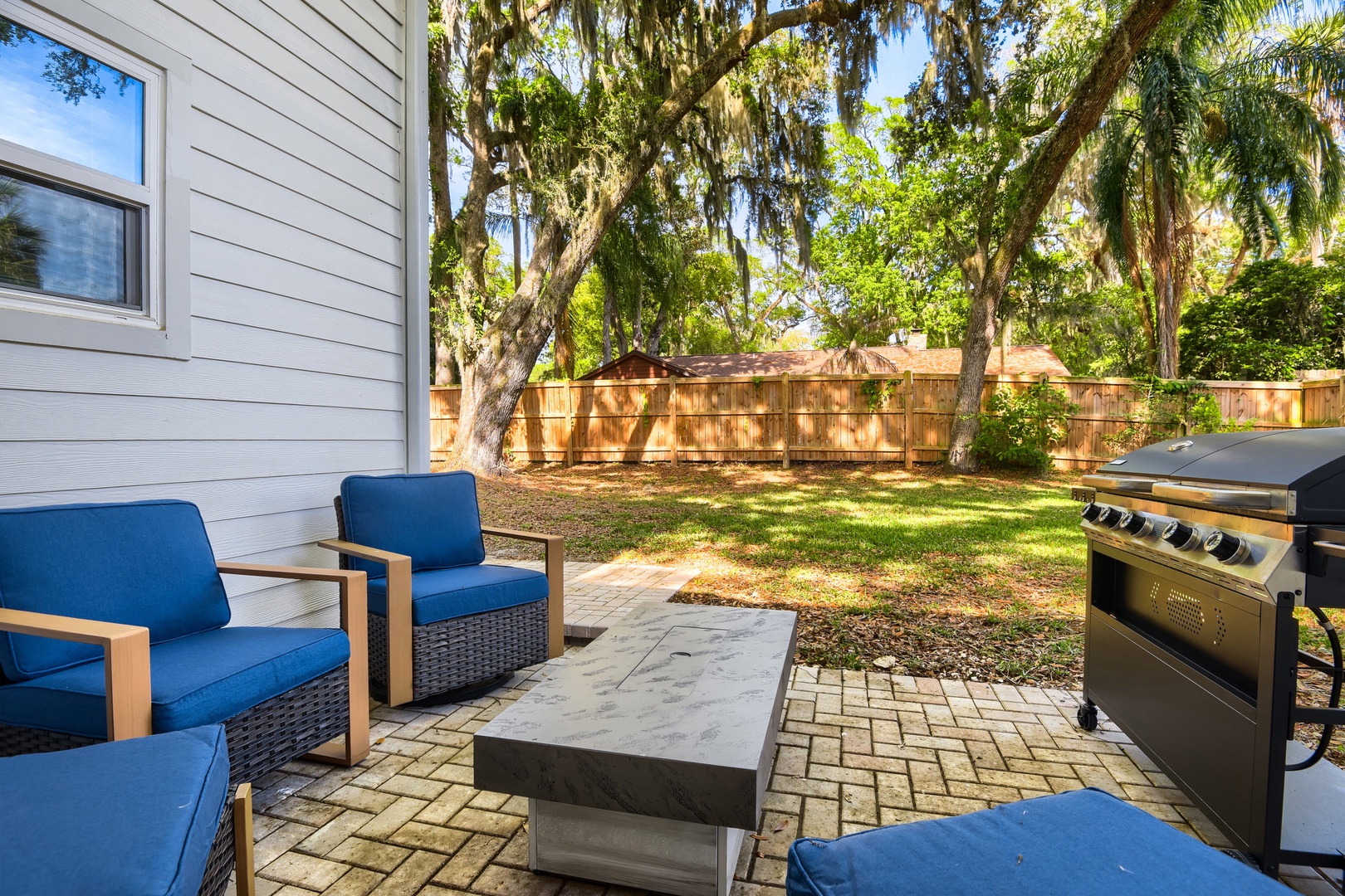 Cozy Backyard Patio with Fire Pit & Grill