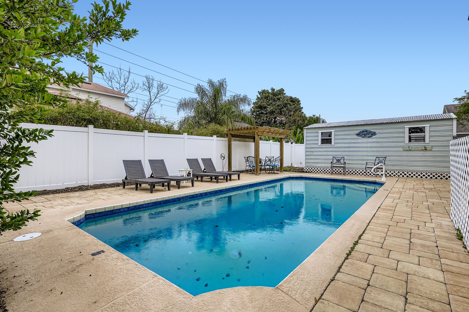 Sun loungers surround heated oasis