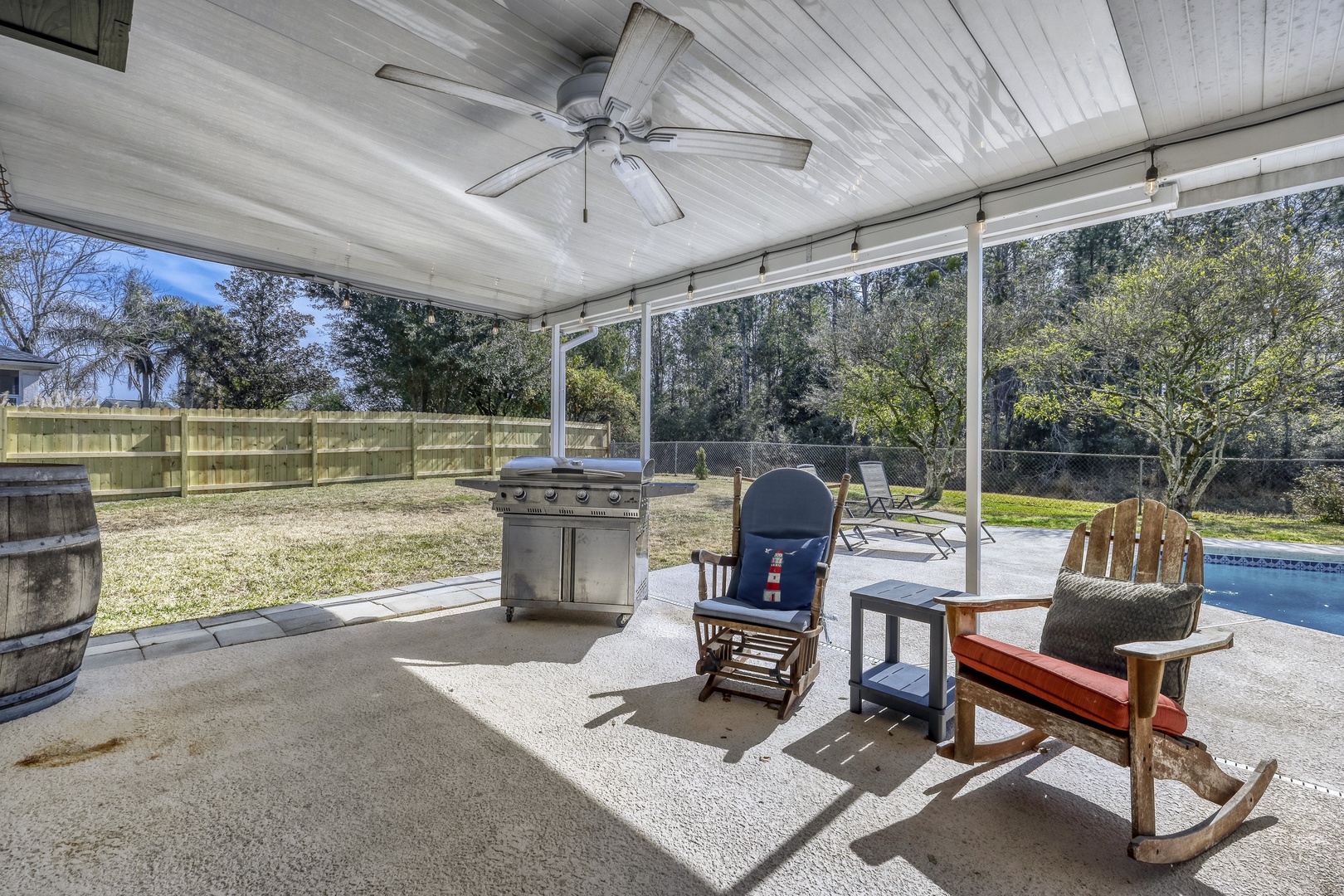 Shaded patio grill TV ceiling fans