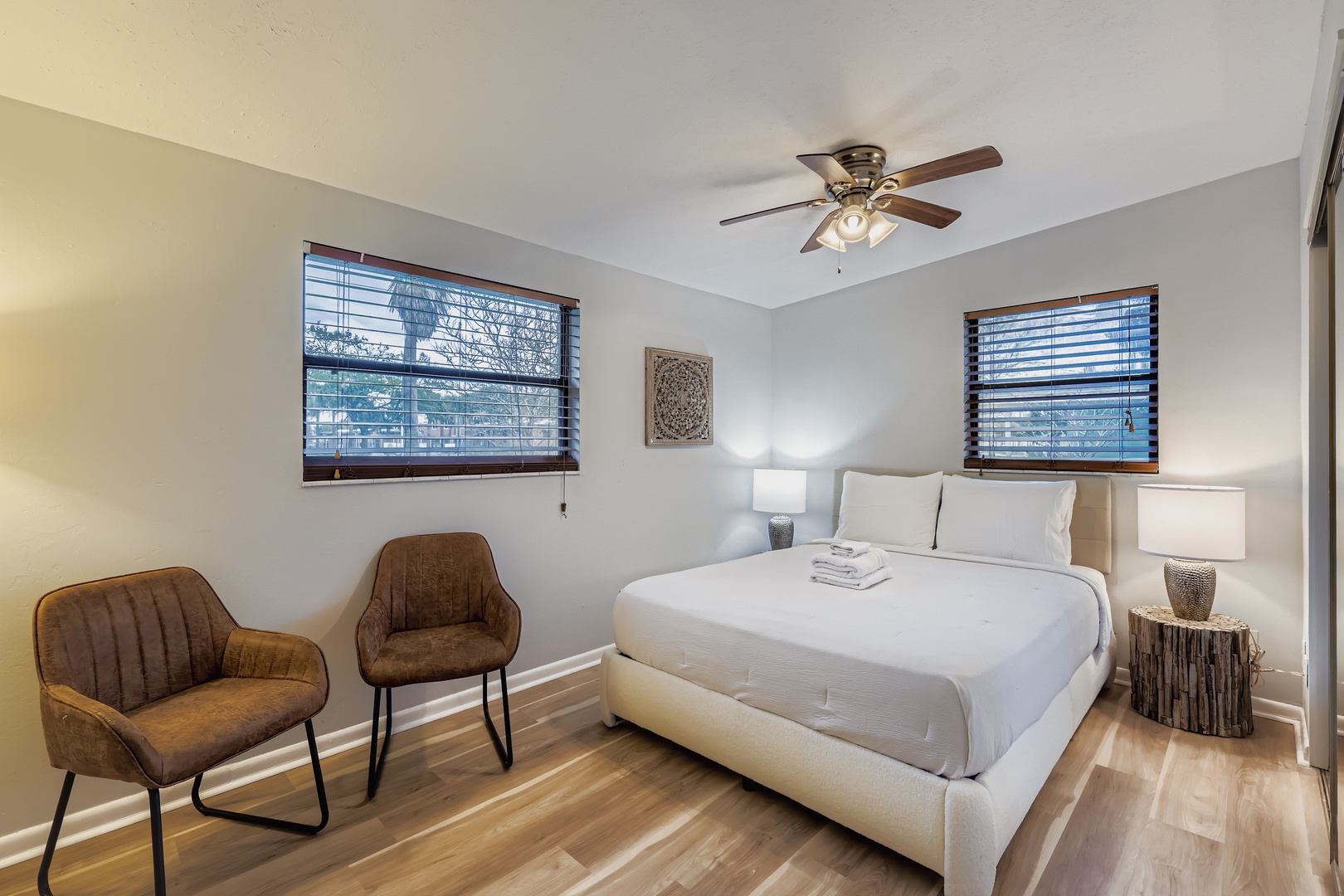 Plush queen bed, cozy seating area.