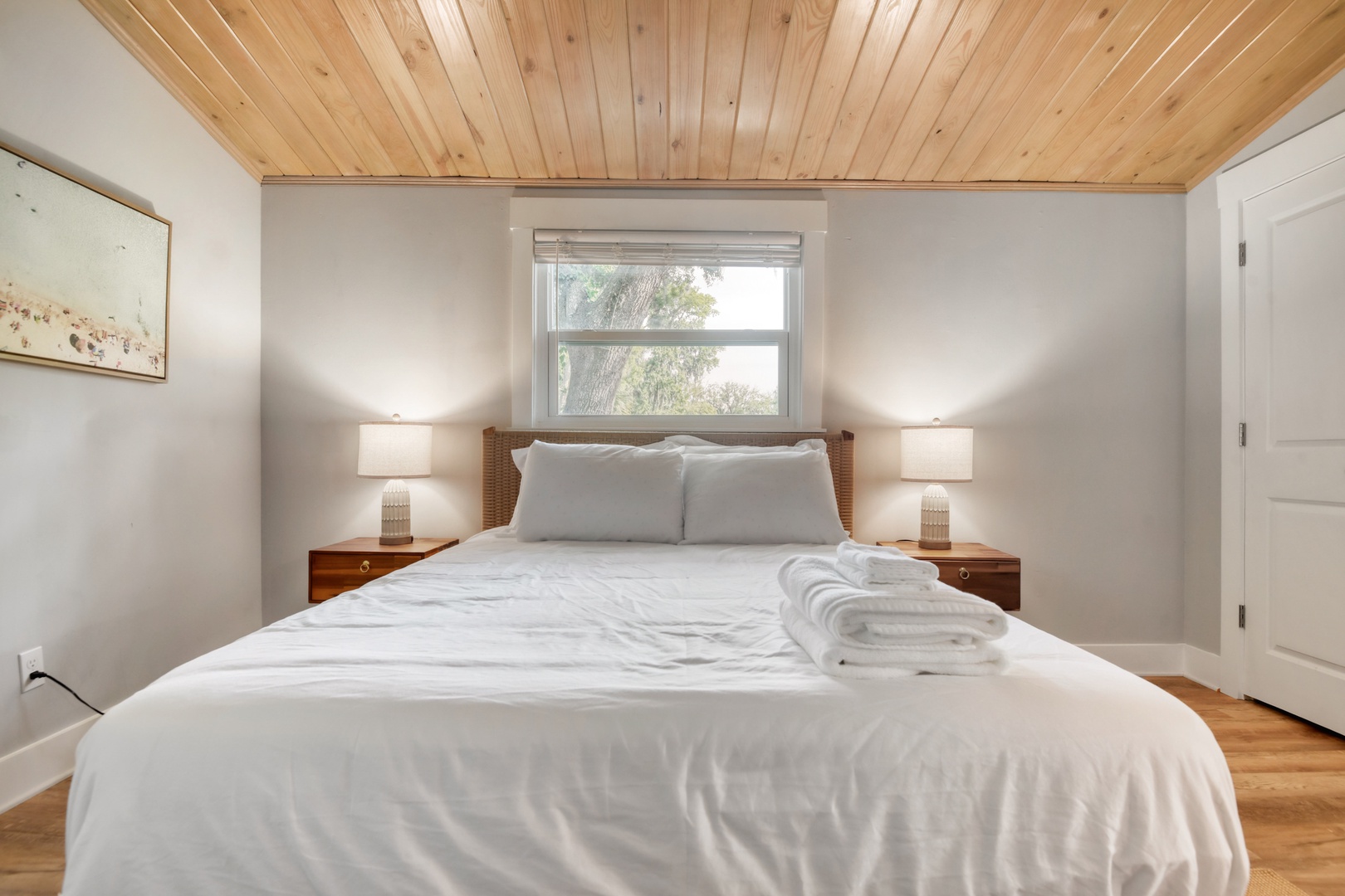 Peaceful Queen Bedroom Under Vaulted Wood Ceilings