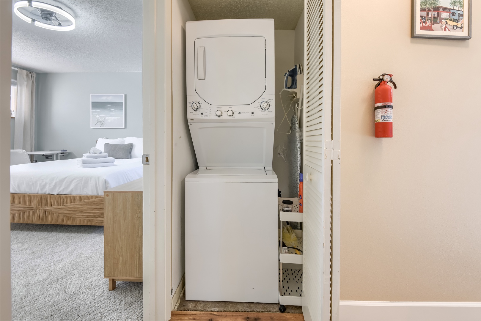 In-unit stackable washer and dryer with an iron for easy packing
