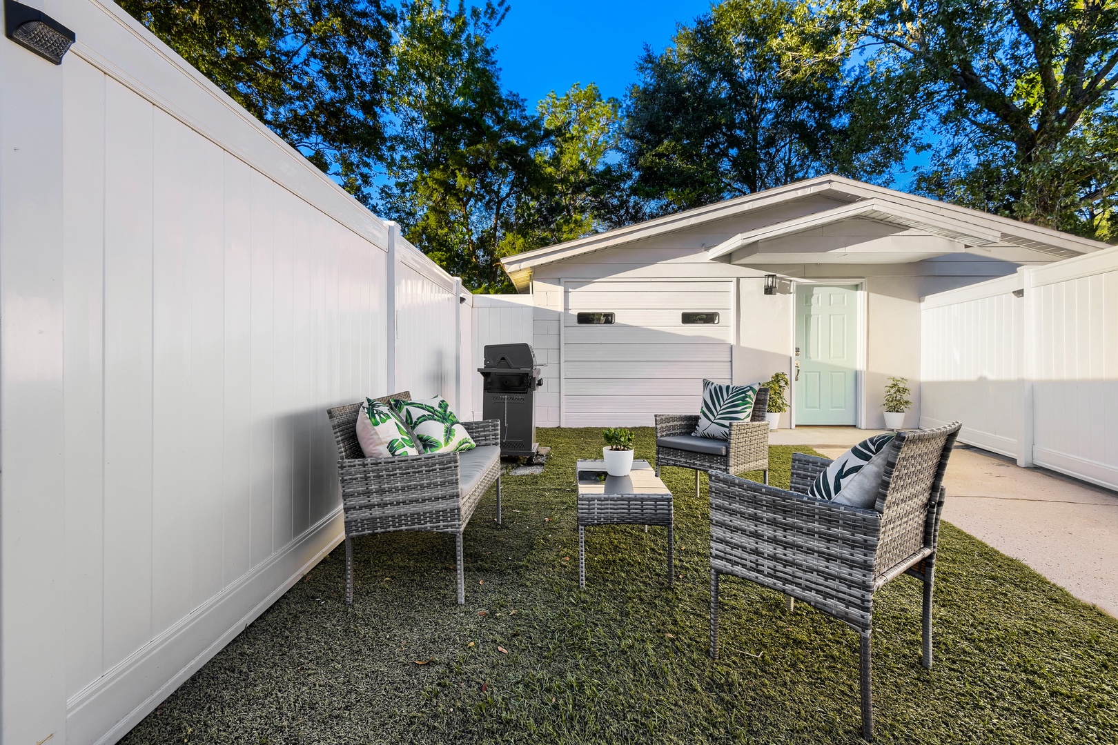 Private entrance and outdoor lounge area in a fully fenced yard